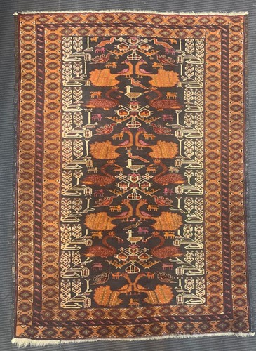 Lot 607 - 20th century Baluchi prayer rug with an...