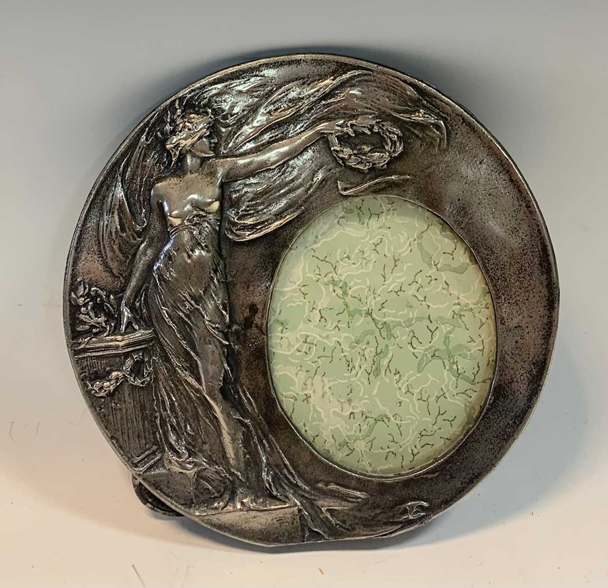 Lot 104 - Art Nouveau circular pewter picture frame, 16...