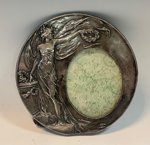 Lot 104 - Art Nouveau circular pewter picture frame, 16...
