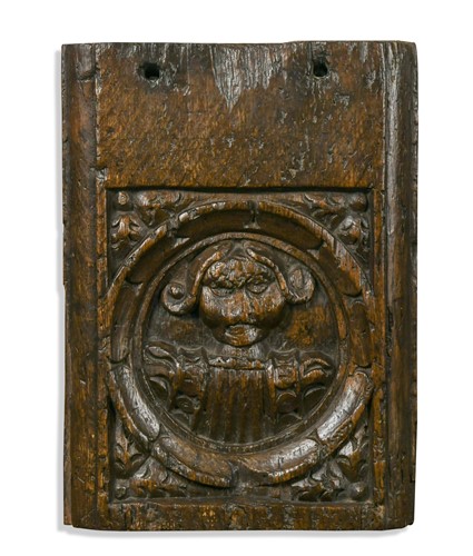 Lot 252 - A Medieval carved oak pew end section, English circa 1500