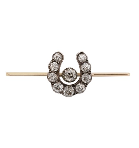 Lot 105 - A Victorian diamond set horseshoe brooch