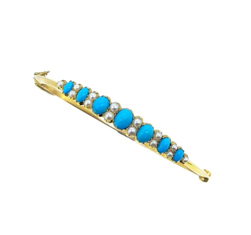 Lot 110 - An early 20th century turquoise and split pearl bangle