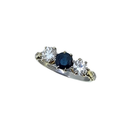 Lot 215 - An early 20th century sapphire and diamond three stone ring