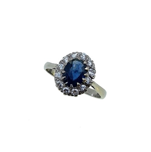 Lot 208 - A sapphire and diamond cluster ring