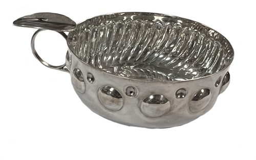 Lot 426 - A French metalwares silver oversized tastevin