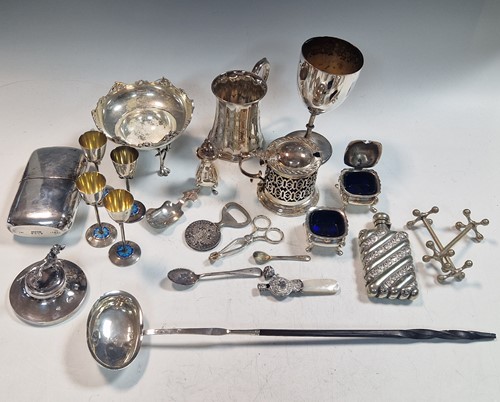 Lot 199 - four silver and enamel egg cups, a silver...
