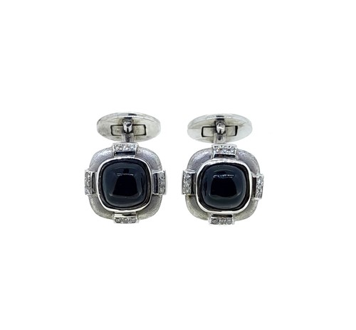 Lot 23 - A pair of onyx and diamond cufflinks
