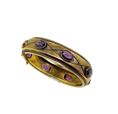 Lot 33 - A garnet bangle
