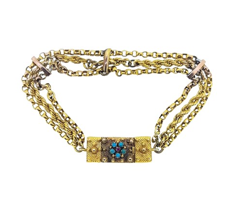 Lot 115 - A three row decorative bracelet