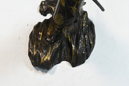 Lot 107 - A Japanese parcel-gilt bronze of a samurai, possibly by Miyao Eisuke