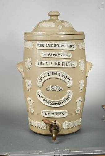Lot 133 - An stoneware Atkins water filter, 61cm high