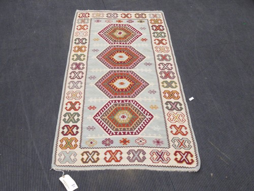 Lot 604 - A cream ground Kilim, 193 x 92cm