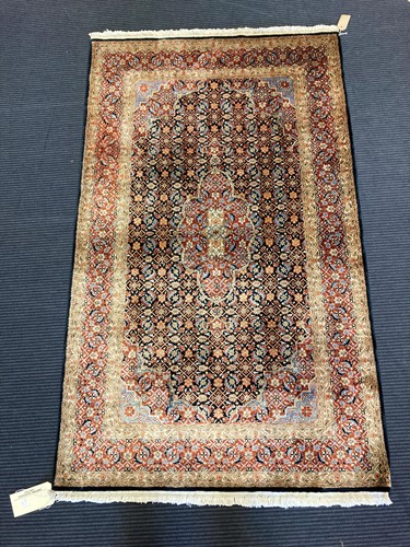 Lot 597 - A silk Tabriz rug, 161 x 95cm