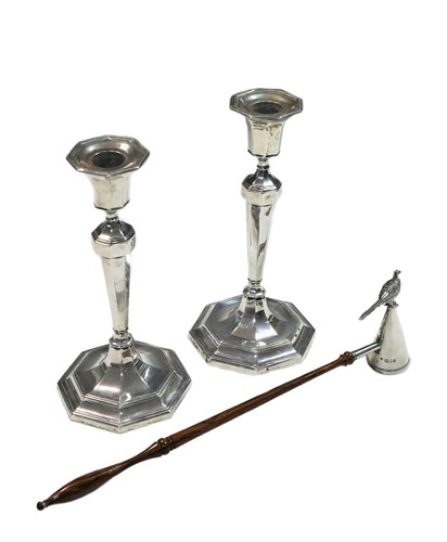 Lot 504 - A pair of George V silver candlesticks with a later snuffer