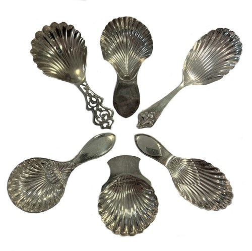 Lot 393 - A collection of six silver caddy spoons with shell bowls, including two 18th century examples