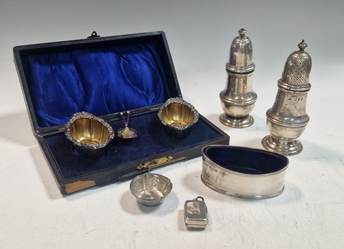 Lot 201 - A silver salt and pepper caster, a single...