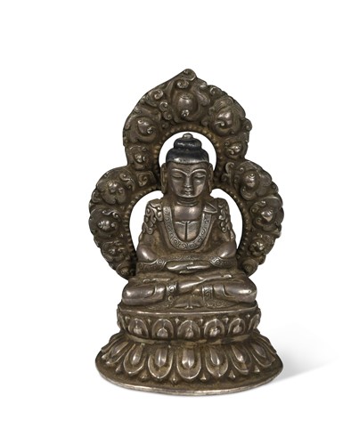 Lot 125 - A Tibetan white metal seated Buddha, 19th/20th century