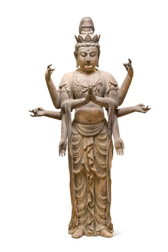 Lot 95 - A Chinese carved and painted wood of eight-armed Avalokiteshvara, Qing Dynasty