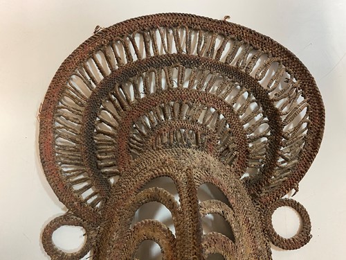 Lot 135 - A Papua New Guinea, Abelam, painted basketry old yam mask