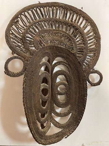 Lot 135 - A Papua New Guinea, Abelam, painted basketry old yam mask