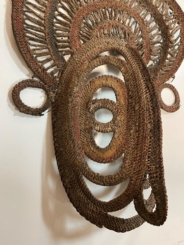 Lot 135 - A Papua New Guinea, Abelam, painted basketry old yam mask