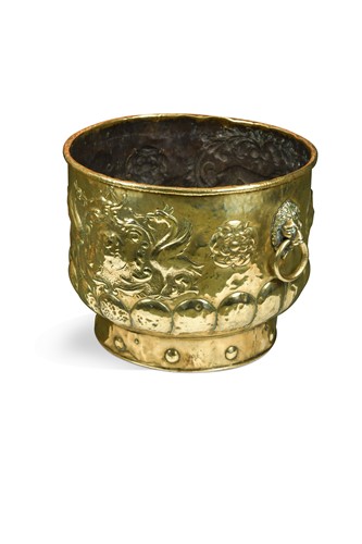 Lot 234 - A Dutch embossed brass decorative log bin, 19th century