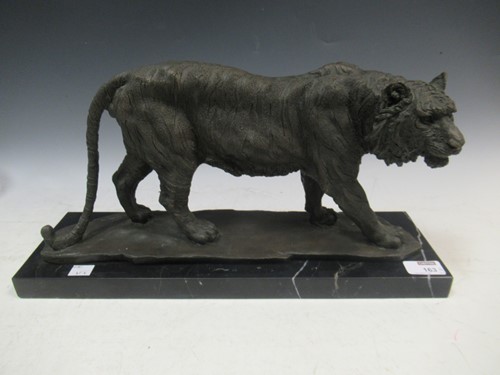 Lot 163A - A cast metal figure of a walking tiger, signed...