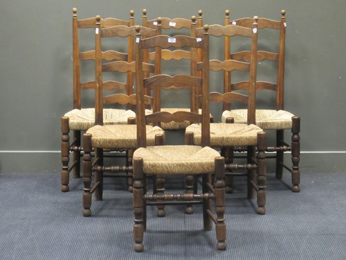Lot 439 - A set of six beech wood and rush ladderback...