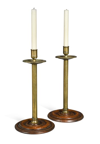 Lot 265 - A pair of George III mahogany and brass candlesticks