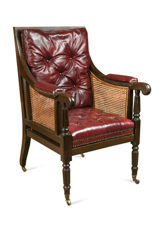 Lot 409 - A caned mahogany bergere library armchair, 19th century