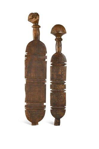 Lot 424 - Two hardwood Tuareg Amazigh tent pegs, North Africa