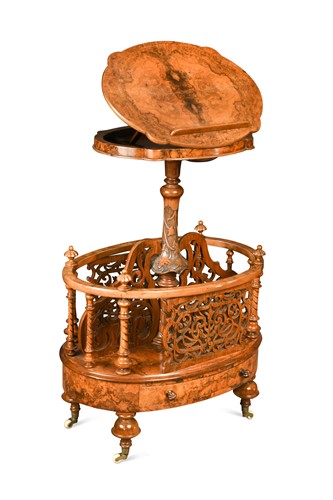 Lot 543 - A Victorian walnut canterbury