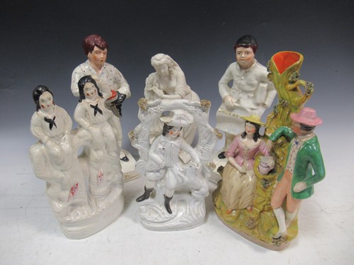 Lot 130 - A group of figural ceramics to include a pair...