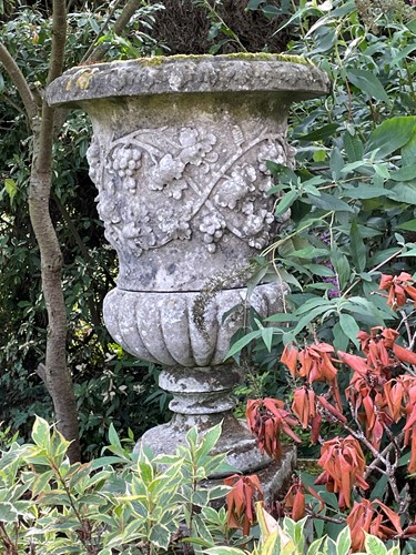 Lot 597 - A Haddonstone composition vine decorated garden urn, 20th century