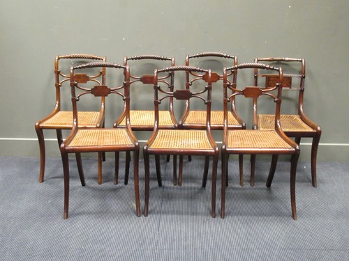 Lot 454 - A set of four Regency caned dining chairs with...