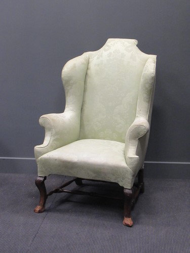 Lot 415 - A William & Mary style wing-back armchair with...