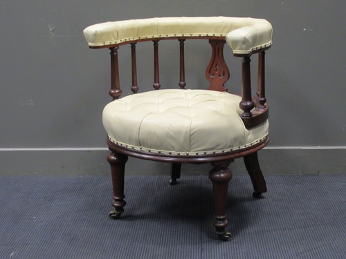 Lot 488 - A mahogany horseshoe shaped leather armchair...