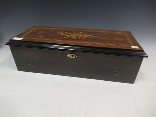 Lot 115 - A Victorian rosewood case music box playing...