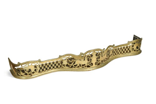 Lot 280 - A George III pierced brass fender
