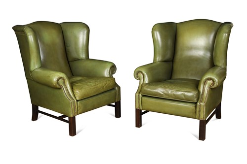 Lot 496 - A pair of leather wingback armchairs, 20th century
