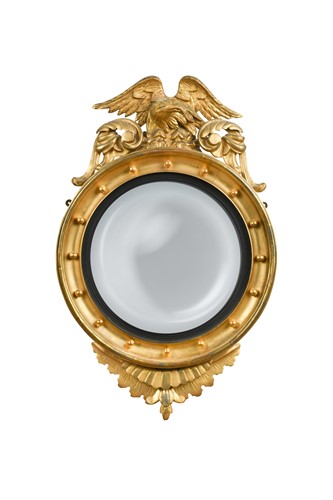 Lot 360 - A carved giltwood convex wall mirror, 19th century