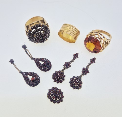 Lot 170 - A garnet cluster ring, tested as 18ct gold, a...