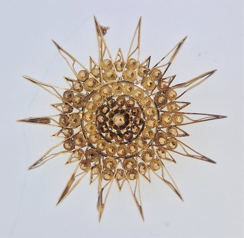 Lot 169 - A star pendant/brooch, tested to at least 18ct...