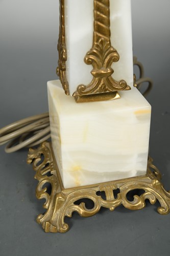 Lot 595 - A white onyx obelisk table lamp