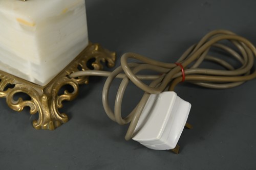 Lot 595 - A white onyx obelisk table lamp