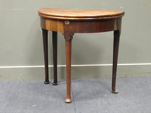 Lot 472 - A mid-18th century mahogany demi-lune tea...