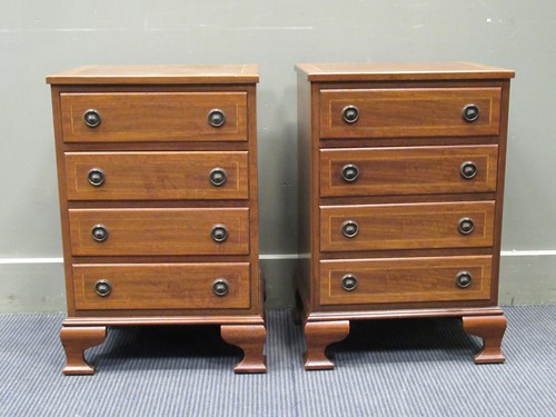Lot 422 - A pair of mahogany four drawer bedside chests,...