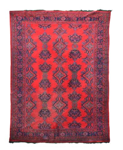 Lot 298 - A large red ground Ushak carpet, circa 1930