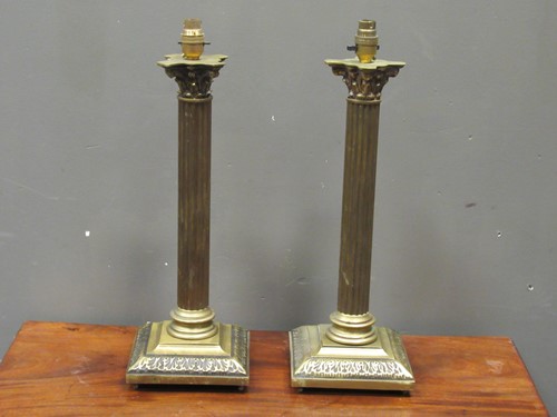Lot 497 - A pair of brass corinthian column lamps, 51cm...