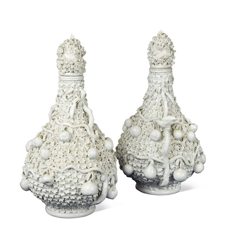 Lot 520 - A pair of Meissen schneeballen bottle vases and covers